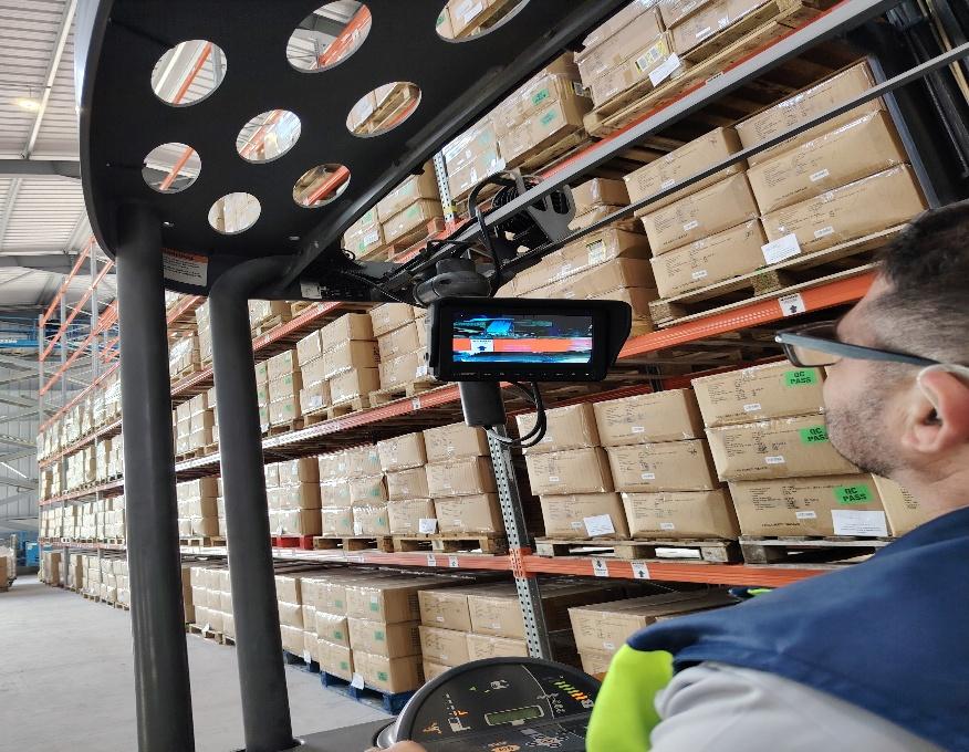 Warehouse worker with handheld scanner